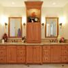 Ten foot run of cabinetry is relieved of any boredom by changing the depth of the center bank of drawers. The lighted  tower adds drama! 