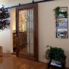 a barn style sliding door made of mahogany and beveled glass lend a bit of provocative privacy.