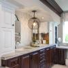 Hidden storage in the towers next to the sinks. Matte finish quartzite countertops go directly into the cabinets to slide items in and out easily.